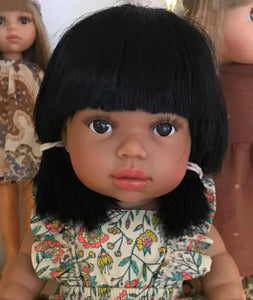 latika a 13 inch minikane Indian doll with dark skin and black hair