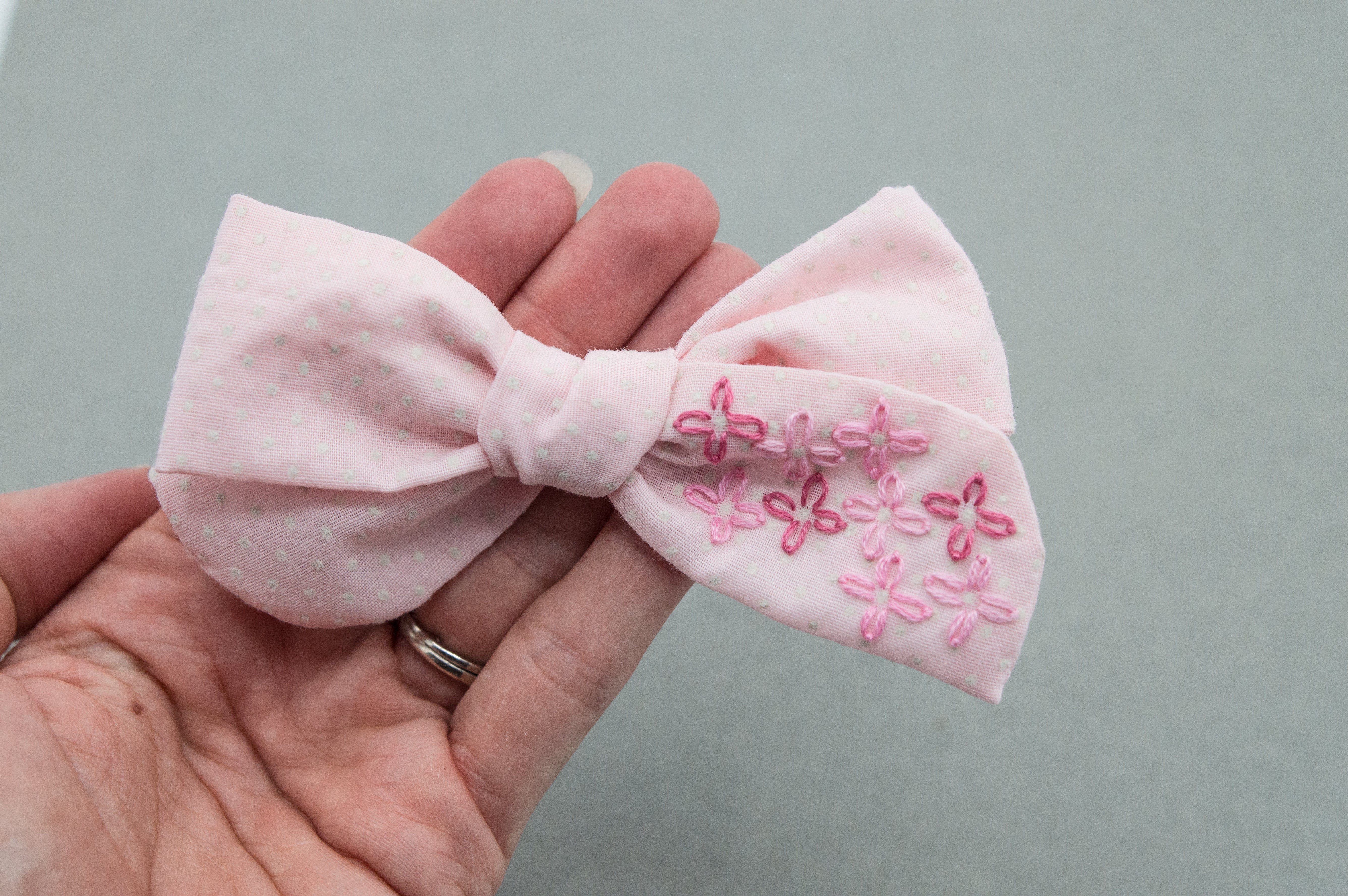 Pink embroidered Swiss River bow - M21